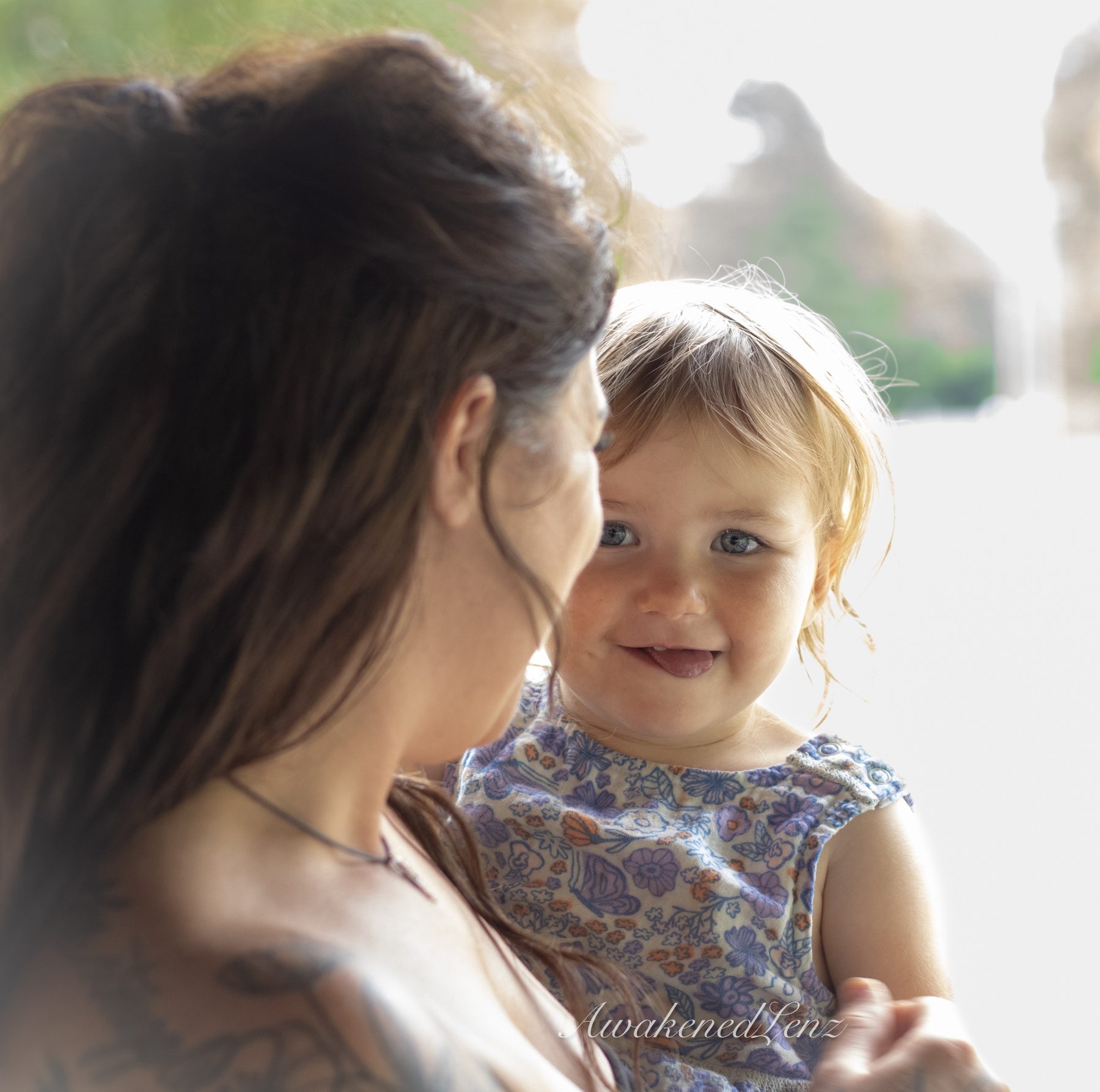 A woman and her toddler niece in a summer meadow, frame 5 of 6