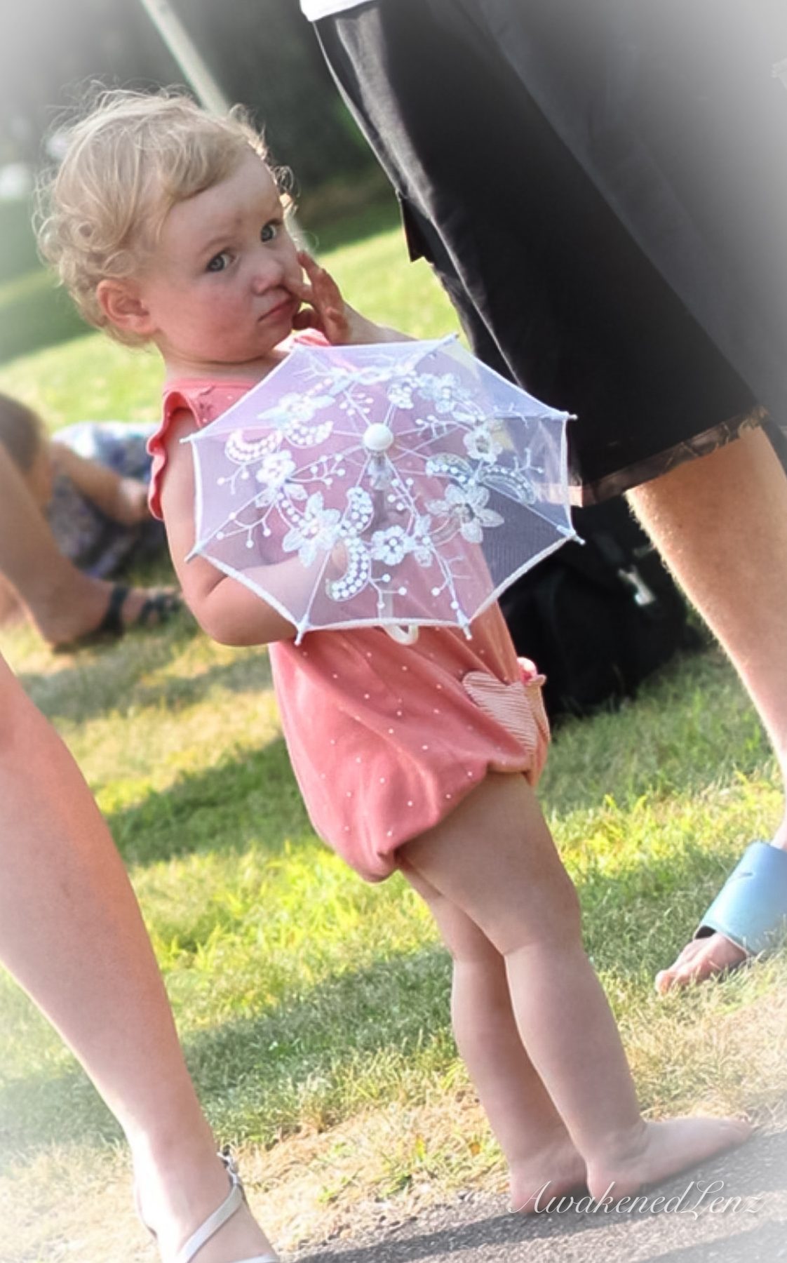 A woman and her toddler niece in a summer meadow, frame 6 of 6