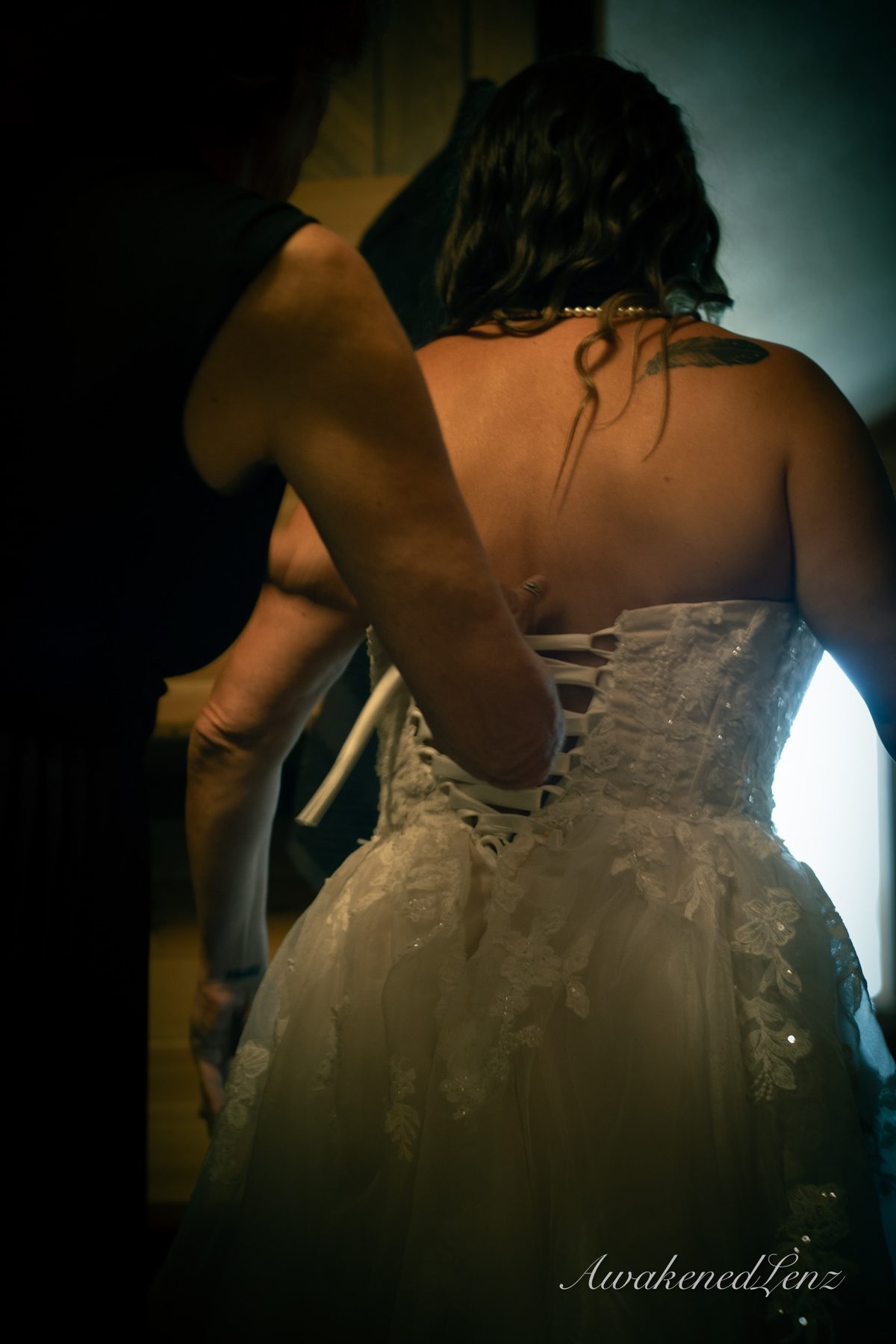 A bride and her party getting ready before a lakeside wedding, frame 3 of 16