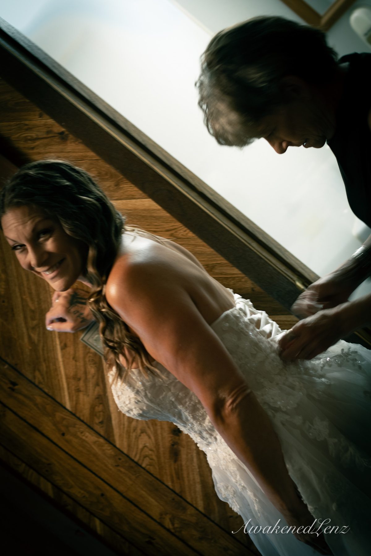 A bride and her party getting ready before a lakeside wedding, frame 4 of 16
