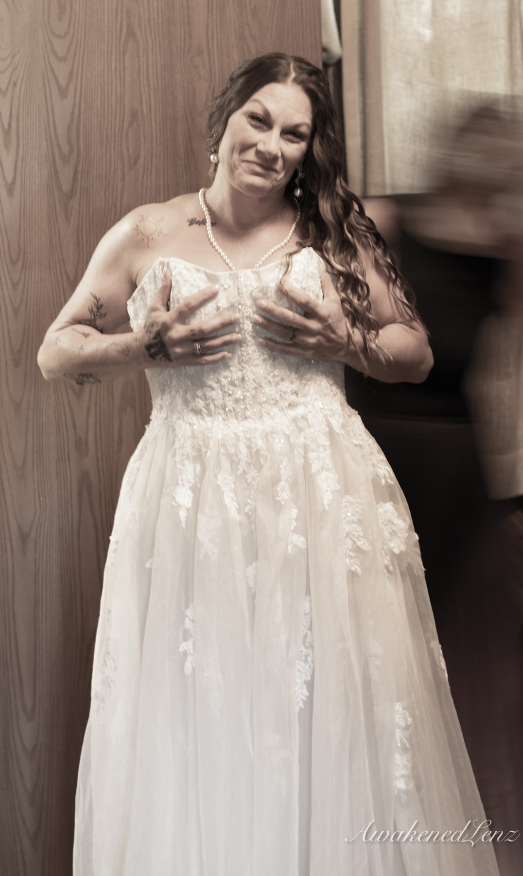 A bride and her party getting ready before a lakeside wedding, frame 7 of 16