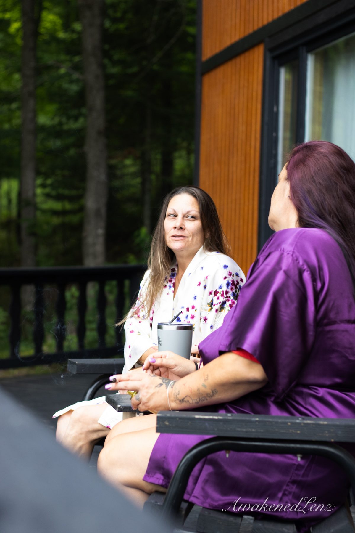 A bride and her party getting ready before a lakeside wedding, frame 9 of 16